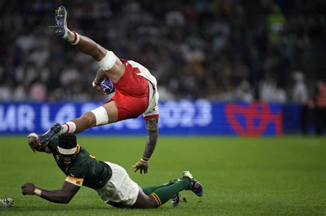 AP PHOTOS: Rugby World Cup quarterfinal race goes down to the wire for 6 of the 8 places