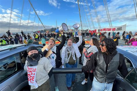 APEC protesters launch actions with Bay Bridge banner