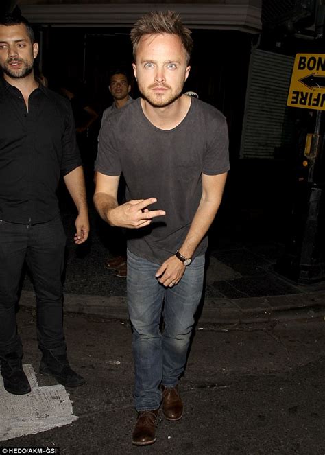 Aaron Paul strikes a silly pose after a night of partying in LA... and