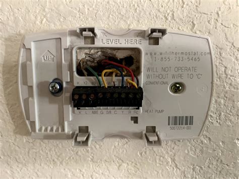 Ac wont kick on. Turn off power to your system at the fuse box or system switch. This will help prevent damage to your system and help keep you safe. Pull off the Nest thermostat display. Check that all connectors that have wires are down (see picture). If needed, re-insert wires so that the connector button stays fully pressed down. 