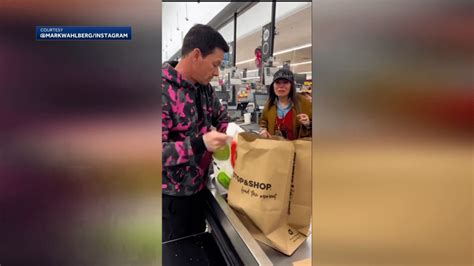 Actor Mark Wahlberg bags groceries during surprise stop at Mass.