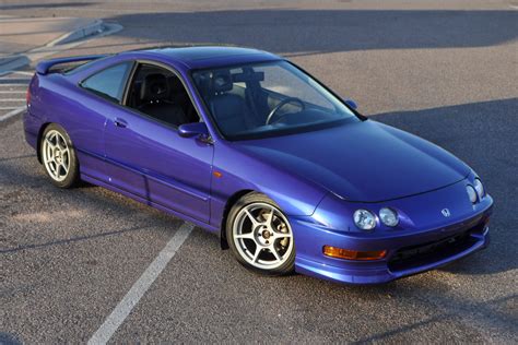 This 1999 Acura Integra GS-R was acquired by the seller in 2002 and has since been registered in Florida and Virginia. It is finished in black over black leather and powered by a 1.8-liter VTEC inline-four paired with a five-speed manual transaxle. Equipment includes a glass sunroof, a rear spoiler, 15″ alloy wheels, air conditioning, cruise .... 