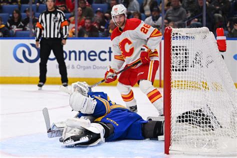 Adam Ruzicka scores the go-ahead goal for the Flames, who beat the sloppy Sabres 4-3
