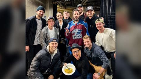 Adam Sandler takes photo with Colorado Eagles hockey team