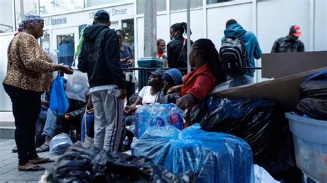 Advocates claim racism as African asylum seekers forced to sleep on Toronto sidewalk