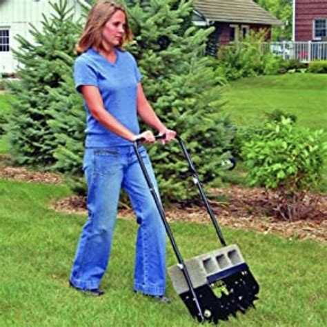 Overview. The Tow-Behind Aerator reduces soil compaction on lawns, promoting the growth of healthy root systems. The tow-behind aerator features a 30-36" working width and 44 Coring tines. Weighs 250lbs. . 