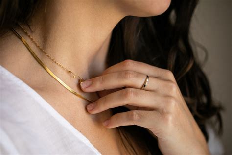 Affordable gold jewelry. Missoma. Missoma makes a collection of small and delicate pieces that pack a strong visual punch. Much of its work is gold-plated brass and sterling silver that looks truly rich against the skin. For layering, you can mix and match rings, necklaces, bracelets, or earrings, which fall within the range of $45–$200. 