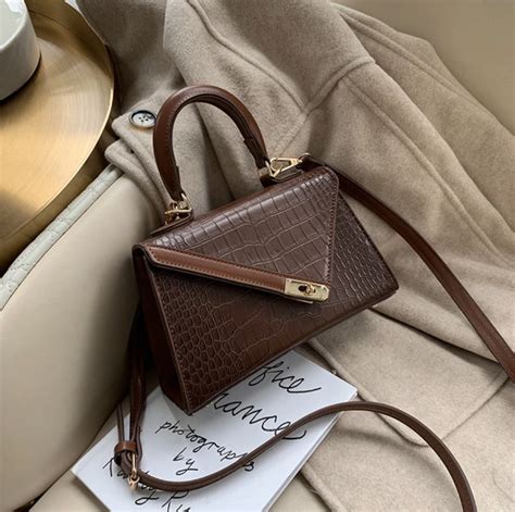 Affordable handbags. Oct 7, 2021 ... Top 10 Affordable Trending Handbags · Instagram's Buzziest Handbags To Buy This Season—All Under $100 · GLITZALL Dumpling Bag · Prime Origi... 