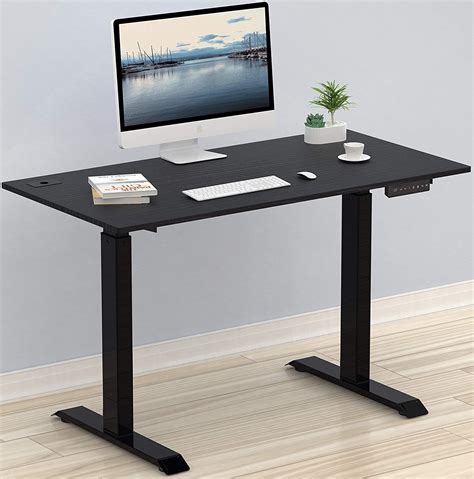Affordable standing desk. This plan presents the DIY Adjustable Standing Desk for a great, affordable, and eco-friendly way to raise your workstation or tabletop. Assembly is super-easy, it only takes ten minutes to put together this sturdy standing desk. This unit adjusts from sitting to standing position in mere seconds. The desk features a brown felt material that is ... 