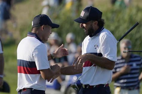 After 28 hours, the U.S. finally wins a full point at the Ryder Cup with rookies Homa and Harman