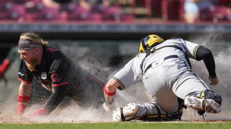 After Burnes’ ejection, Brewers beat Reds 5-4 in 11 innings