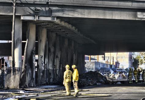 After massive fire closes Los Angeles interstate, motorists urged to take public transport