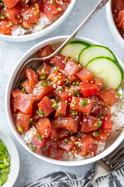 Ahi tuna poke. Instructions. Cube the ahi tuna and put into a bowl, add the soy sauce, rice vinegar, sesame oil, sriracha ,ginger, garlic and sesame seeds and mix. Let it sit for a few minutes. While the tuna is resting, cook your rice and prep your toppings. When you are ready to serve, put the rice in the bowl, top with the tuna and add your toppings. 