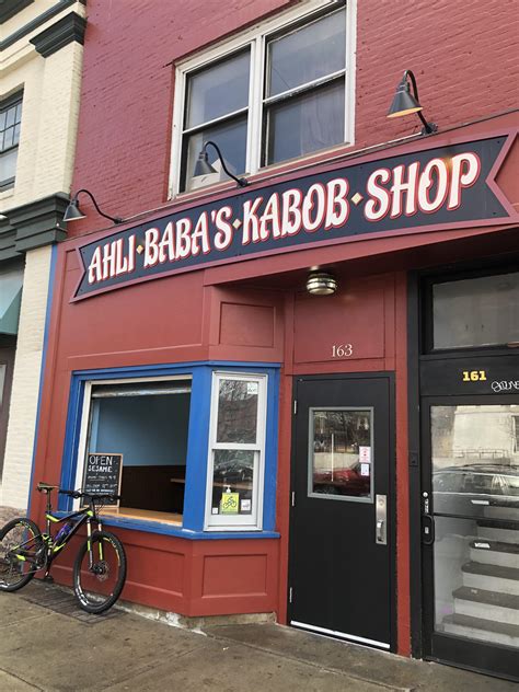 A trash can fire in front of Ahli Baba’s Kabob Shop 