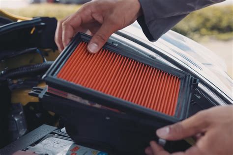 Air filter change. 3 Place the new filter inside of the cover with the side that says FRONT facing outward. 4 Align the tabs on the filter cover with the hooks on the refrigerator wall. Rotate the air filter cover clockwise until the hooks engage and the cover locks in place. 