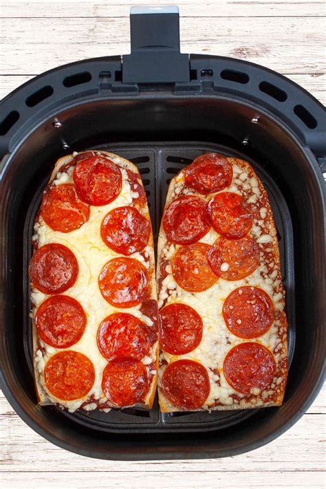 Air fryer french bread pizza. Set the air fryer to 385 degrees. Add a spoonful of sauce to each slice of toast, then spread to the edges. Top the pieces of toast with mozzarella cheese, and a sprinkle of parmesan if desired. Then add slices of pepperoni (and any other desired toppings). Place in the preheated air fryer (however many will fit at once), and cook for 5 … 