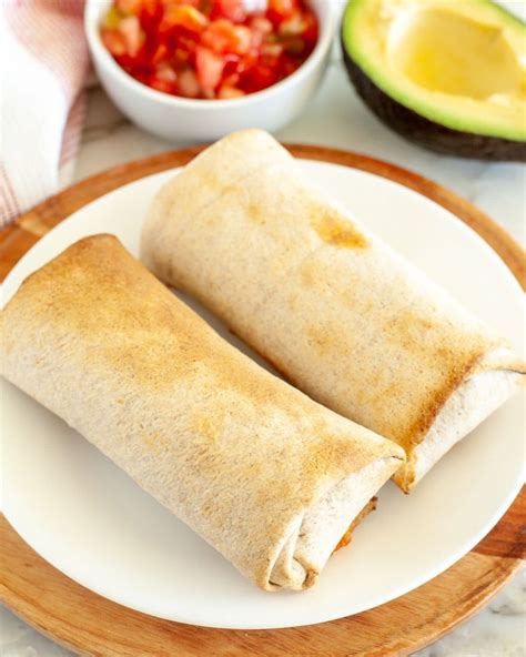 Air fryer frozen burritos. Instructions. Preheat air fryer to 400 F. Remove the Trader Joe’s burritos from their packages and place them in the air fryer basket. Air fry the burritos for around 6 to 8 minutes. Turn the burritos and air fry them for another 5 to 7 minutes. Serve the Trader Joe’s burritos with dipping sauce and French fries. 