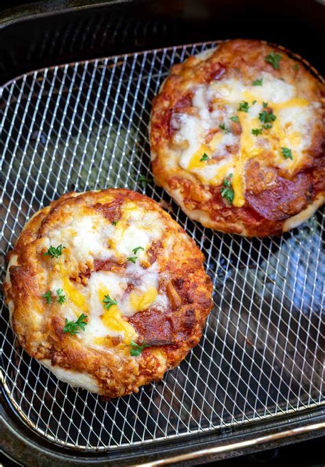 Air fryer frozen pizza. Place the flatbreads (naan) in air fryer bottom side up (make sure it is in just a single layer – cook in batches if needed). Air Fry at 360°F/182°C about 2-3 minutes. Flip the flatbreads over. Continue to Air fry at 360°F/182°C for another 1-2 minutes (if you want the crust extra crispy – air fry each side a couple minutes more). 