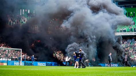 Ajax’s game abandoned after smoke bombs thrown onto pitch in Dutch soccer league