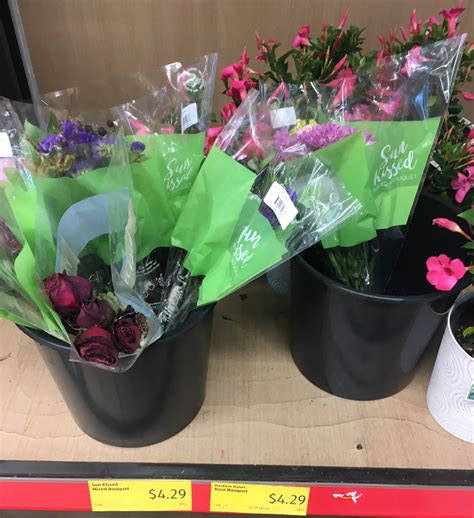 Aldi flowers. Once flowers arrive home, cut at least 2cm off the end of each stem. Fill a clean vase with water and remove leaves left on stems below the water line. HINT: Try to cut stems at an angle. Flowers take in more nutrients this way. 