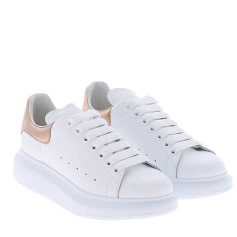 Alexander mcqueen sneaker women. Mixed-scale crystals embellish the color-pop counter of a signature leather sneaker grounded by a chunky sole with leopard-embossed tread. 1 1/2" heel; 1" platform. Lace-up style. Leather upper and lining/rubber sole. Made in Italy. Women's Designer Shoes. 