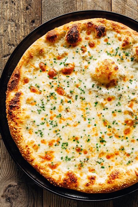 Alfredo pizza. Apr 8, 2020 · Sauté garlic. Melt butter in a large saucepan or sauté pan over medium-high heat. Add garlic and sauté for 1 minute, stirring frequently. Stir in the flour and sauté for 1 minute more, stirring frequently. Add the milk and cream. Add in the heavy cream and milk and whisk until evenly combined. Simmer. 