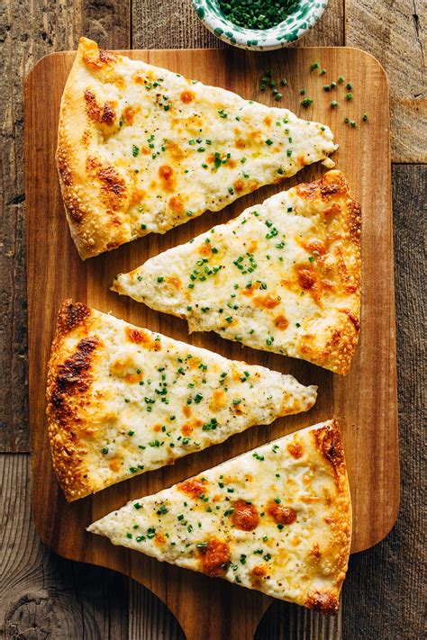 Alfredo sauce pizza. Garlic: a Tasteful Addition. The garlic-enhanced Parmesan white sauce serves as the base for the Cali Bacon Chicken Ranch pizza with premium grilled chicken breast, smoked bacon, tomatoes, and 100 percent real mozzarella and provolone cheeses on a cheesy provolone crust. Garlic elevates the mild grilled chicken, … 