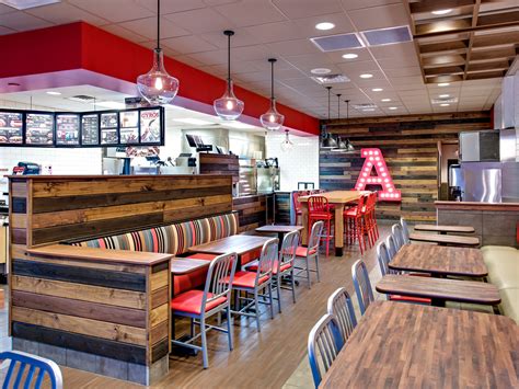 Resembling a roadside rest stop, the world's largest Arby's is designed to be welcoming and comfortable to all travelers on Interstate 95. Smooth granite tiles go under a procession of American flags, leading to a large stone-hewn fireplace right across from the counter. The dining room, lush with carpeted floors and padded booths, is .... 