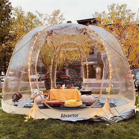 Alvantor pop up bubble tent. Feature: Patented pop-up design. One person can easily install and fold down. Portable and super lightweight for all outdoor activities. Super clear sides provide a 540-degree viewing. Fully enclosed keep warm in winter. Double-side zippers for easy entry and exit. Spacious interior shelter fits 4-6 adults. Sturdy and durable fiberglass structure. 