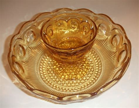 Amber depression glass bowl. For Sale - Vintage Glass from Maggie Belle's Memories - Offered here is a lovely amber Paneled Optic Depression Glass Pedestal Bowl with a Rolled and Etched ... 