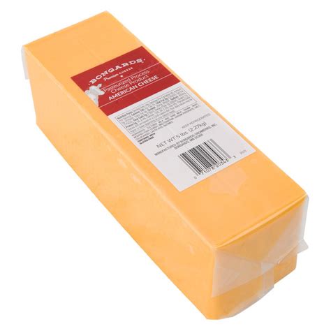 American cheese in a block. The store I shop at has both white and yellow American cheese in block form at the deli counter. I really like the white for Mexican cheese dips. At my grandfather's restaurant we would use a hand slicer to cut the blocks of american cheese. I loved doing it, I would always sneak a slice or two for me. 