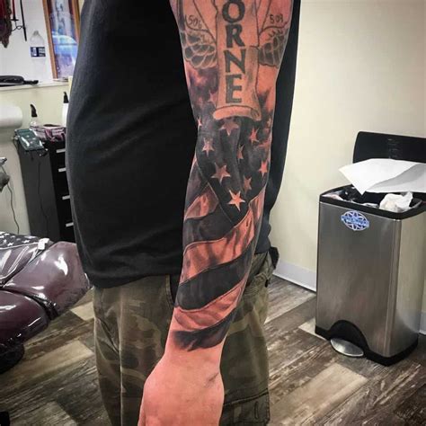 The tattoo depicts an American flag that 