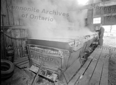 Amos Gingerich overseeing the maple syrup evaporator