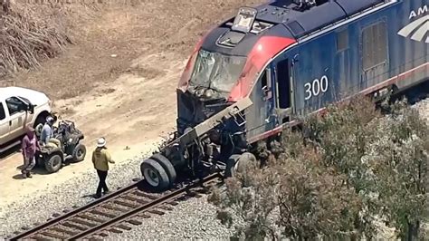 Amtrak train with 198 passengers derails after hitting truck on tracks in Southern California