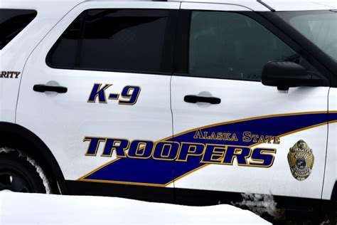 An Alaska State Trooper fatally shoots a man seen brandishing a rifle outside motel, authorities say