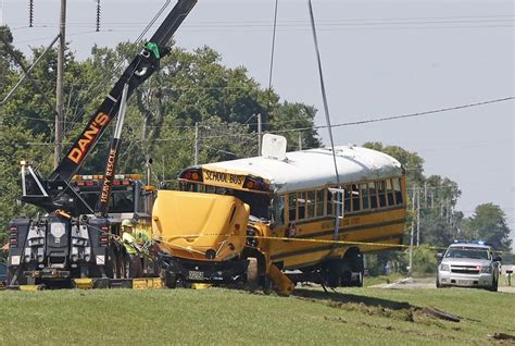An Ohio school bus overturns after crash with minivan, leaving 1 child dead and 23 injured