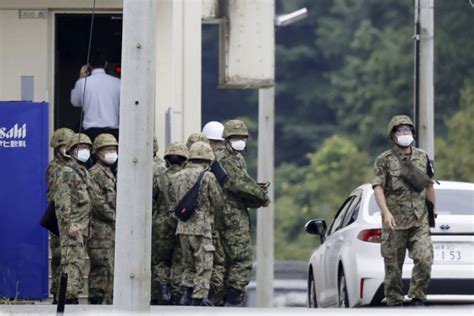 An army official says two of the three soldiers shot at a firing range on a Japanese army base have died