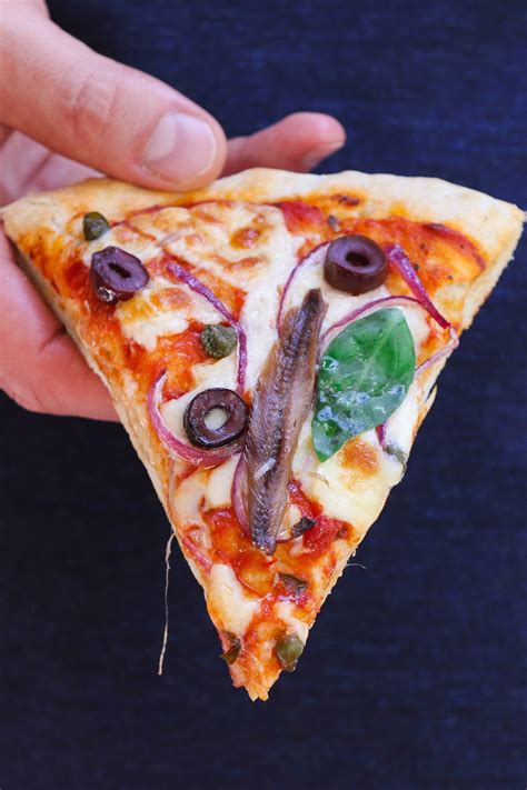 Anchovie pizza. When thousands of Italian immigrants started arriving in the United States during the late 1800s, they brought their culture, traditions, and food with them. And that included pizz... 
