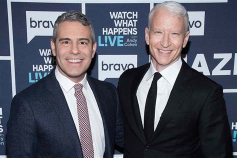 Anderson cooper and andy cohen. Anderson Cooper and Andy Cohen are back on the BOOZE as they break last year's prohibition and down tequila shots at New Year's Eve show in Times Square. By Mackenzie Tatananni For Dailymail.Com. 