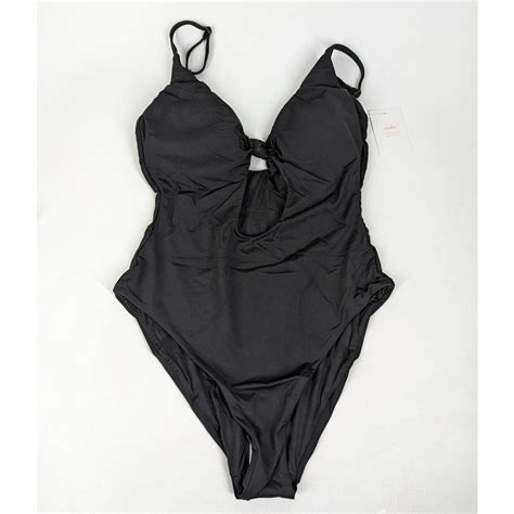 Andieswim. Wear a sizez 14 or 16 bottom. I ordered size Large with long torso (LT) and it fits really well. All snaps open to slide on and easy snap back in, although I like the look of a few unsnapped. Nice bult in bra shelf. Previous reviews really helped me decide which size to confidently order. it's classic, comfy with superb coverage. 