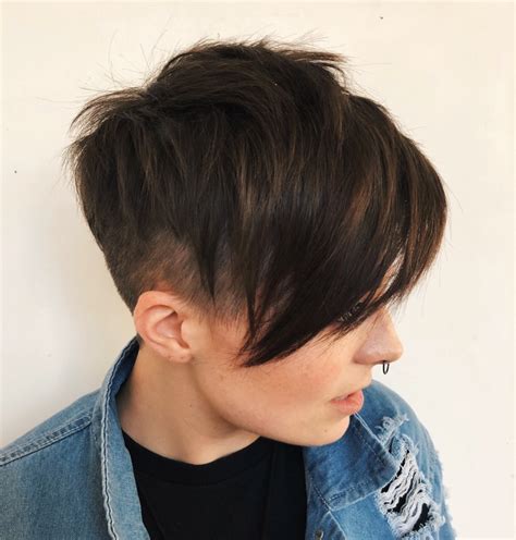 The Quiff. The quiff is a super popular androgynous hairstyle because just about anyone can wear it. Better for thicker hair, it’s styled up and back with lots of volume. Whether you just keep the sides short, or go in for a buzz undercut for an edgier look, this style will elongate the face shape. #2.. 
