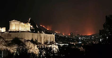 Anger rises in Greece as fires destroy homes near Athens