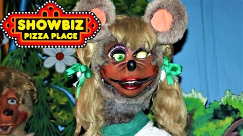 Mitzi Mozzarella is a cheerleader and the female vocalist of The Rock-afire Explosion who was later developed to be an important role model for young girls. When the Wolf Pack 5 was created in 1978, the lead female vocalist was Queenie the Fox. When the Wolf Pack 5 was placed into the first ShowBiz Pizza Place, Queenie was changed into a mouse named Mini Mozzarella. This was done to go along .... 