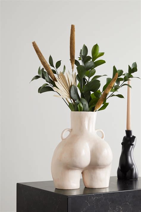 Anissa kermiche. DHL Express - Rest of world, 7-10 working days £25. This Love Handles Vase in classic white is a striking piece of earthenware to add to any decor. Its unique shape and expert craftsmanship make it a timeless choice that is sure to become a classic. Made in Portugal Height: 31cm Width: 21cm Depth: 15cm Weight (g): 2.17. 