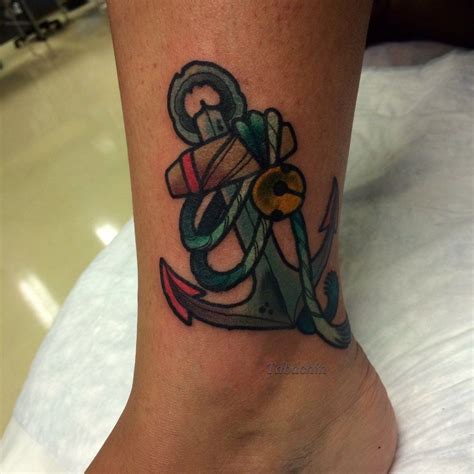 A pretty ankle anchor tattoo adorns the ankle with 