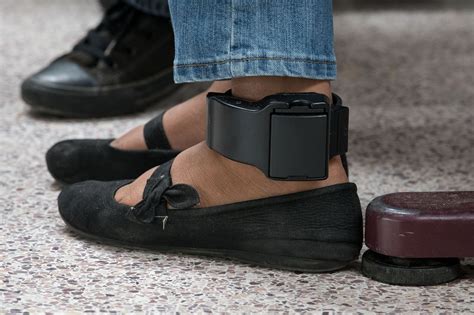Ankle monitor. An ankle monitor, often employed by law enforcement as a surveillance tool, serves as a tether to the justice system for individuals on parole or house arrest. … 