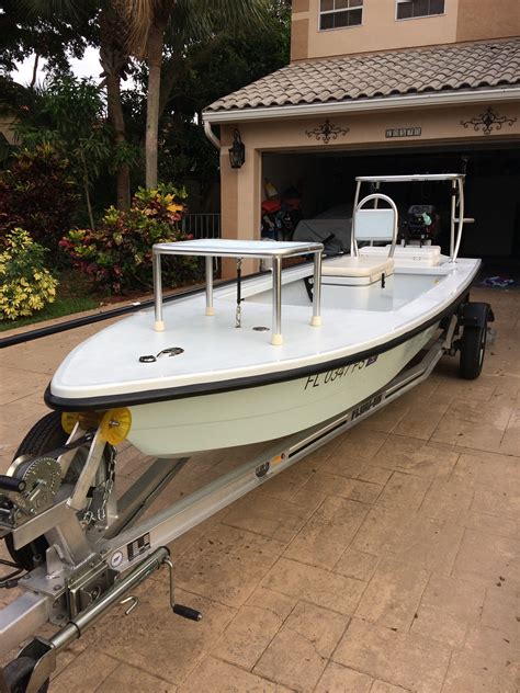 Selling a 2014 Ankona Shadowcast 18'. Full Molded Deck Cap w/ Gunnels, Carpeted Sides. Original owner. Garage kept. Flushed with fresh water and washed after each use. Bought as a bare bones tiller/poling skiff. Runs and floats very skinny. Engine serviced regularly, well maintained. 2014 - Shadowcast 18' (ice blue hull / white decks).