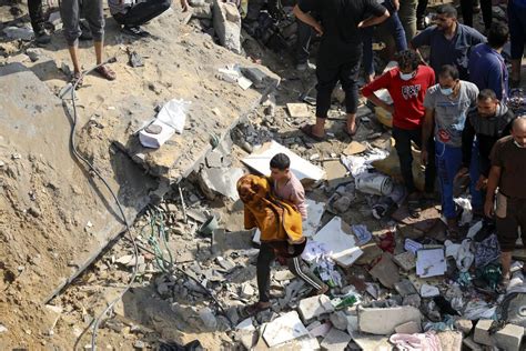 Another wave of Israeli strikes hit Gaza refugee camp as crossing opens for foreigners and wounded