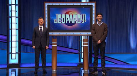It’s time for a new week of Jeopardy! episodes; this is scheduled to be Ken Jennings’ final week of episodes this season. Our returning champion is Canadian, and a librarian named Emma: Winnipeg librarian Emma Hill Kepron has two victories! Her challengers today are Dillon Hupp from Arkansas and Année Rousseau from Alameda.. 