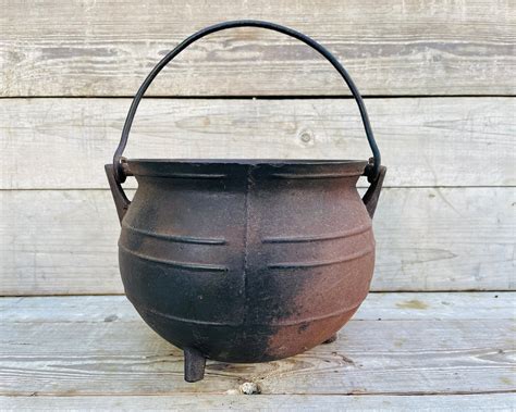 Antique cast iron cauldron. EXTRA LARGE Antique Cast Iron Cauldron with GREAT Look, 1800s Barn Find Potbelly Pot, Witches Pot, Old West Bean Pot, Garden Decor, Yard Art (1.1k) $ 2,500.00. FREE shipping Add to Favorites Cast Iron Cauldrons (4) $ 39.99. FREE shipping Add to Favorites Cast Iron Cauldrons campfire cooking or Witches Brewing ... 